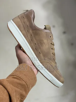 Brown Caterpillar (CAT) Leather Sneaker With a White Rubber Sole