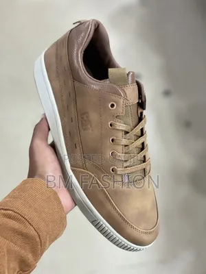 Brown Caterpillar (CAT) Leather Sneaker With a White Rubber Sole