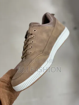 Brown Caterpillar (CAT) Leather Sneaker With a White Rubber Sole