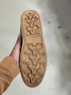 Brown Caterpillar (CAT) Leather Sneaker With a White Rubber Sole