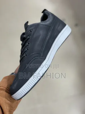 Cat Dark Blue Flat Shoe Leather With Embossed CAT Branding on the Side