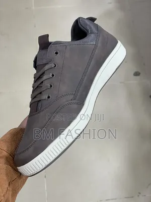 Leather (CAT) Casual Sneaker White Rubber Sole and Tonal Stitching