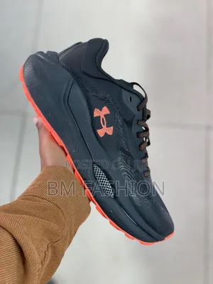 Under Armour Athletic Sneaker in Black With Bright Orange Accents