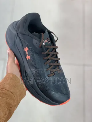Under Armour Athletic Sneaker in Black With Bright Orange Accents
