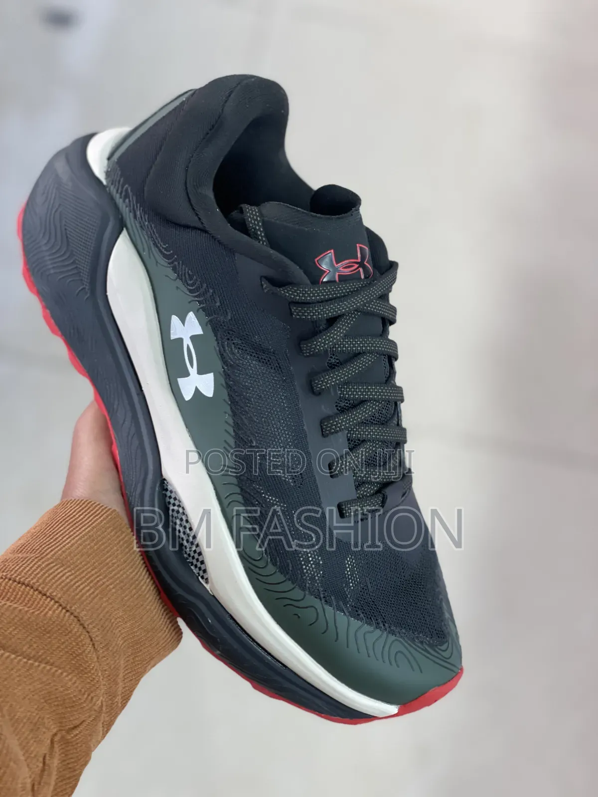 Under Armour Charged Revitaliz Running Sneaker Featuring Dark Colorway