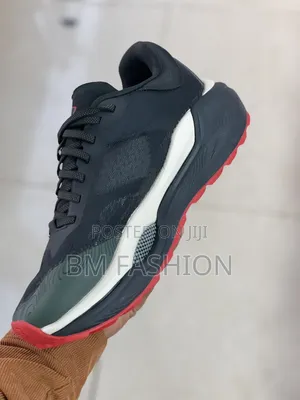 Under Armour Charged Revitaliz Running Sneaker Featuring Dark Colorway
