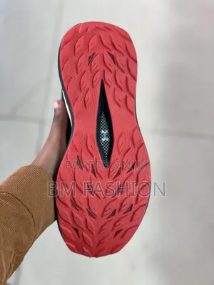 Under Armour Charged Revitaliz Running Sneaker Featuring Dark Colorway