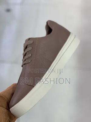 Brown Tumbled Leather Sneaker "Santoni" Featuring a Textured Side Logo