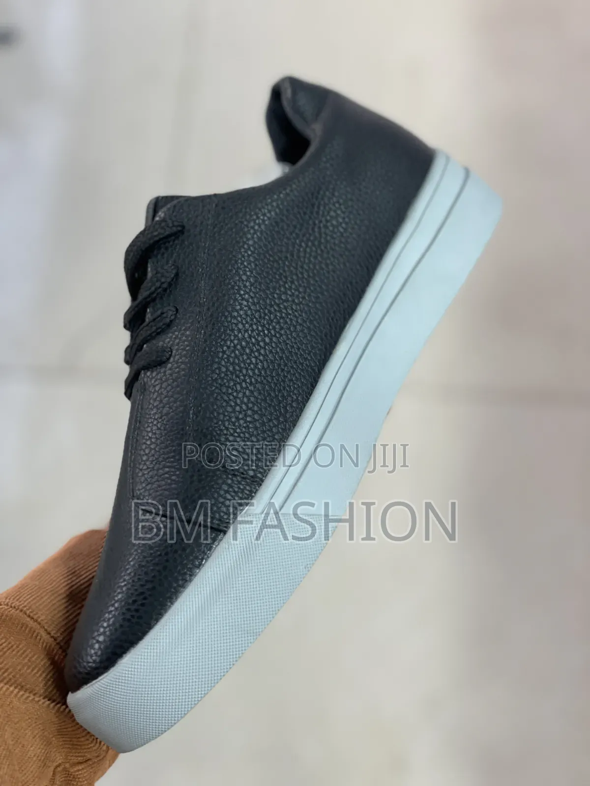 Santoni Black Grained Leather Low-Top Sneaker From the Luxury Brand