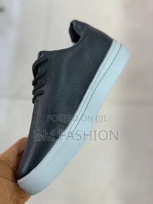 Santoni Black Grained Leather Low-Top Sneaker From the Luxury Brand