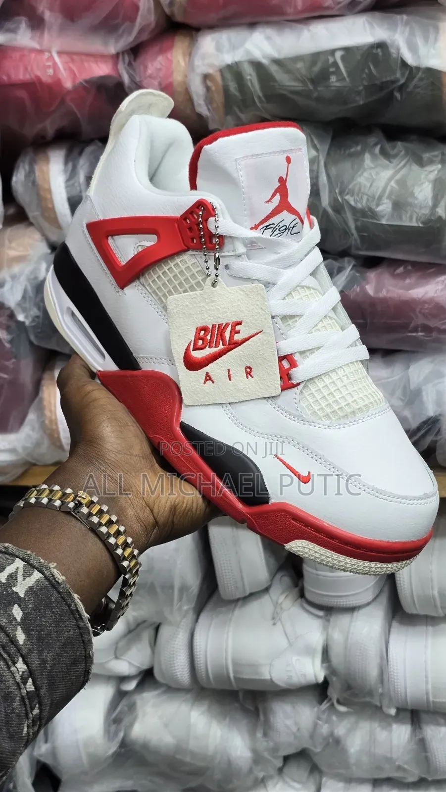 Air Jordan 4 Retro Sneaker "Bike Air" Red-and-White Hangtag