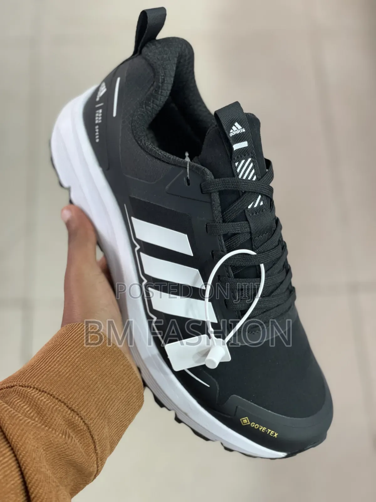 Black-and-White Adidas Athletic Sneaker Featuring Three-Stripe