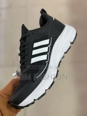 Black-and-White Adidas Athletic Sneaker Featuring Three-Stripe