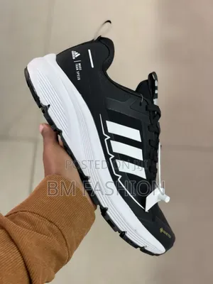 Black-and-White Adidas Athletic Sneaker Featuring Three-Stripe