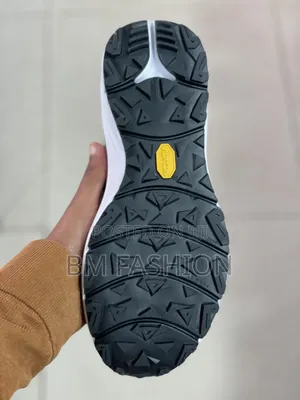 Black-and-White Adidas Athletic Sneaker Featuring Three-Stripe