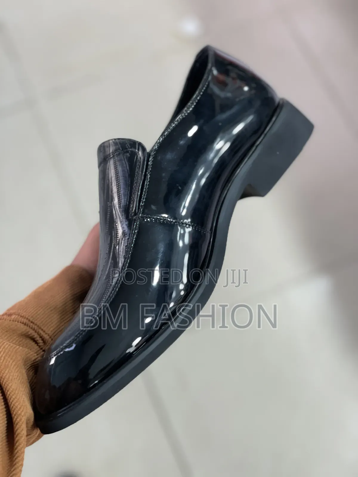Black Glossy Men's Slip-on Dress Shoe Featuring a Textured Finish