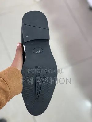 Black Glossy Men's Slip-on Dress Shoe Featuring a Textured Finish