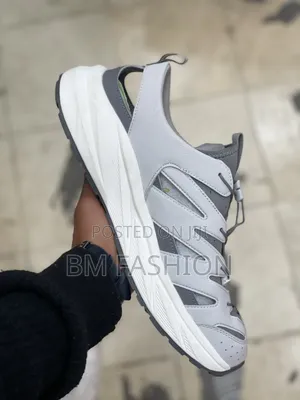 Light Gray and Dark Gray Athletic Hybrid Sandal Featuring Cutouts