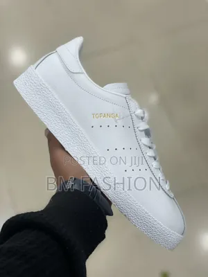 White Leather Adidas Topanga Sneakers Featuring Gold Foil Branding