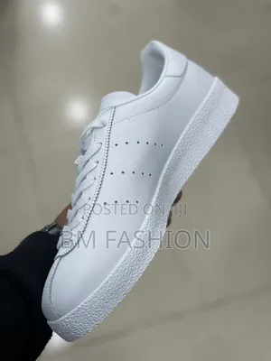 White Leather Adidas Topanga Sneakers Featuring Gold Foil Branding