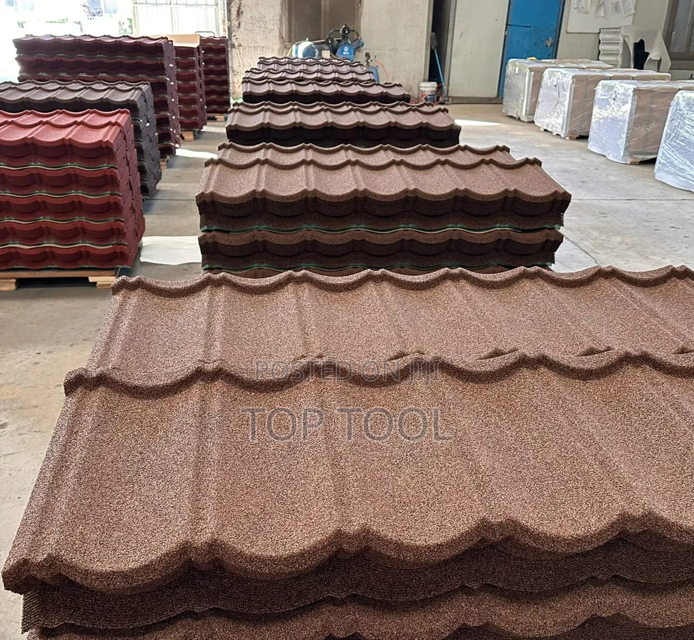 ,Stack of Brown Stone-Coated Metal Roof Tiles Designed to Resembl