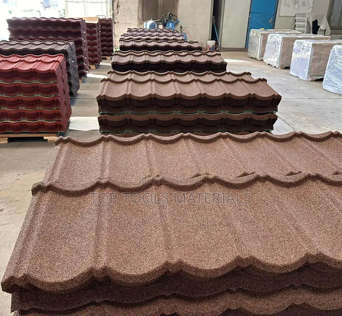 ,Stack of Brown Stone-Coated Metal Roof Tiles Designed to Resembl