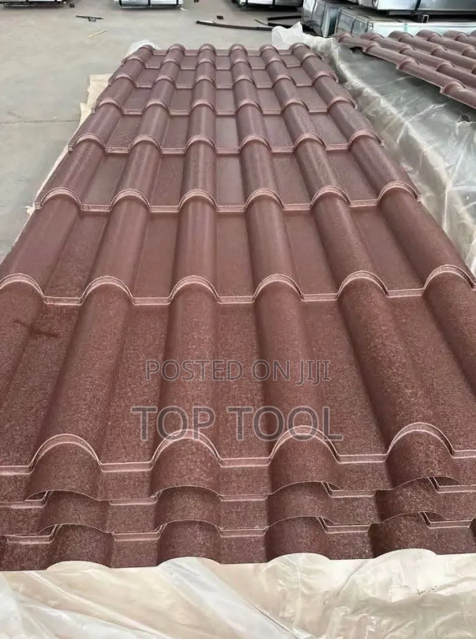 ,Stack of Brown Stone-Coated Metal Roof Tiles Designed to Resembl