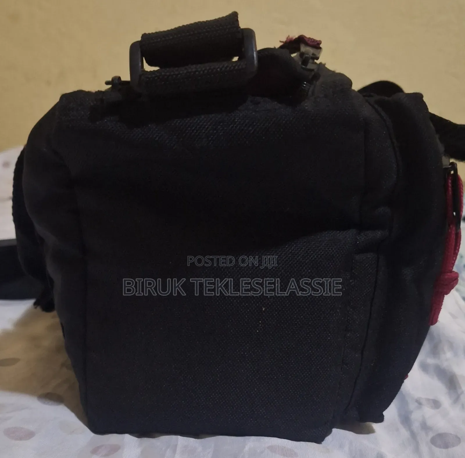 Used Camera Carrying Bag Case With an Adjustable Strap Buckle on Top