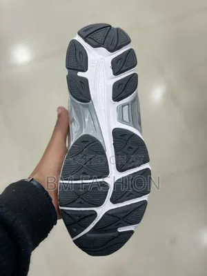 Asics White Running Footwear With Silver Accents and Cushioned Base
