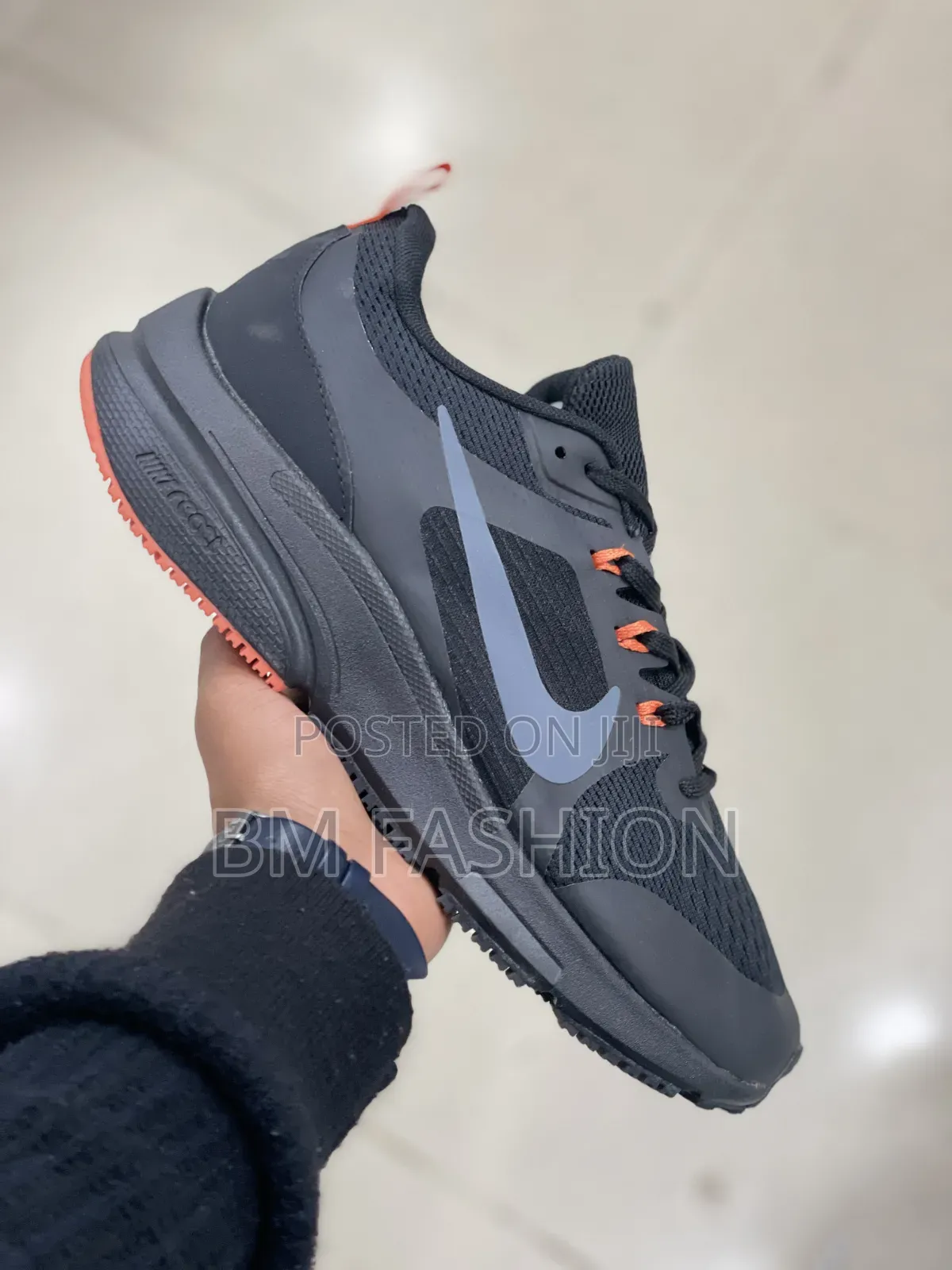 Nike Dark Performance Shoes With Orange Details and Grip Outsole