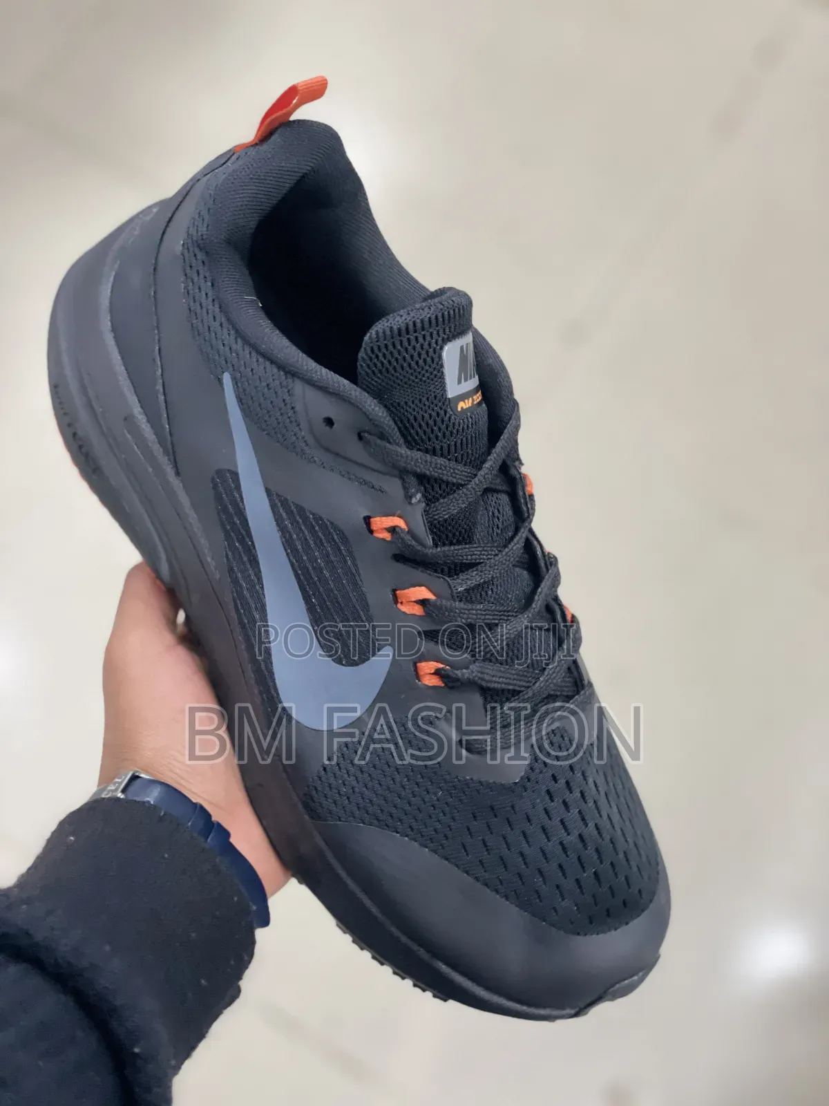 Nike Dark Performance Shoes With Orange Details and Grip Outsole