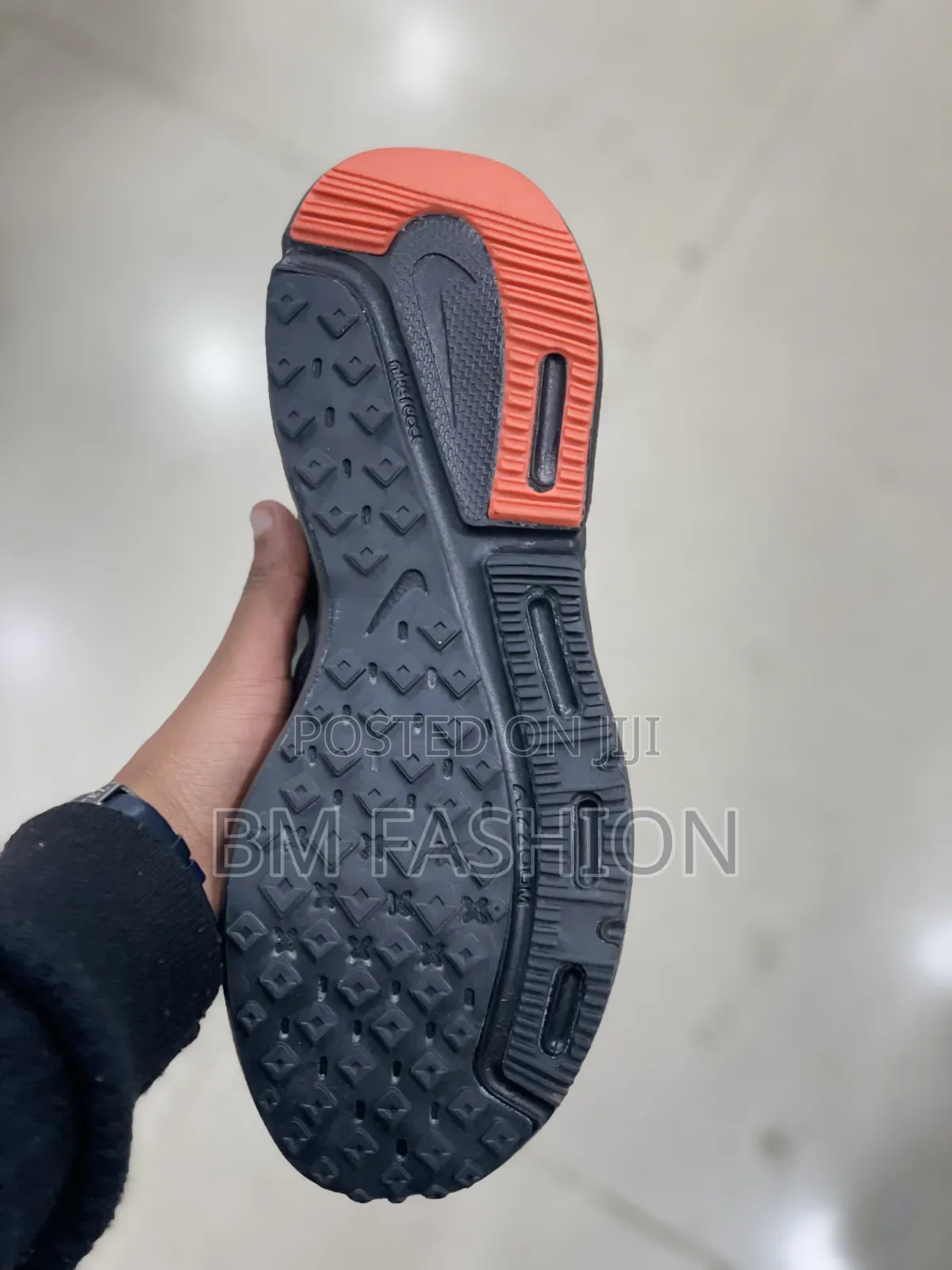 Nike Dark Performance Shoes With Orange Details and Grip Outsole