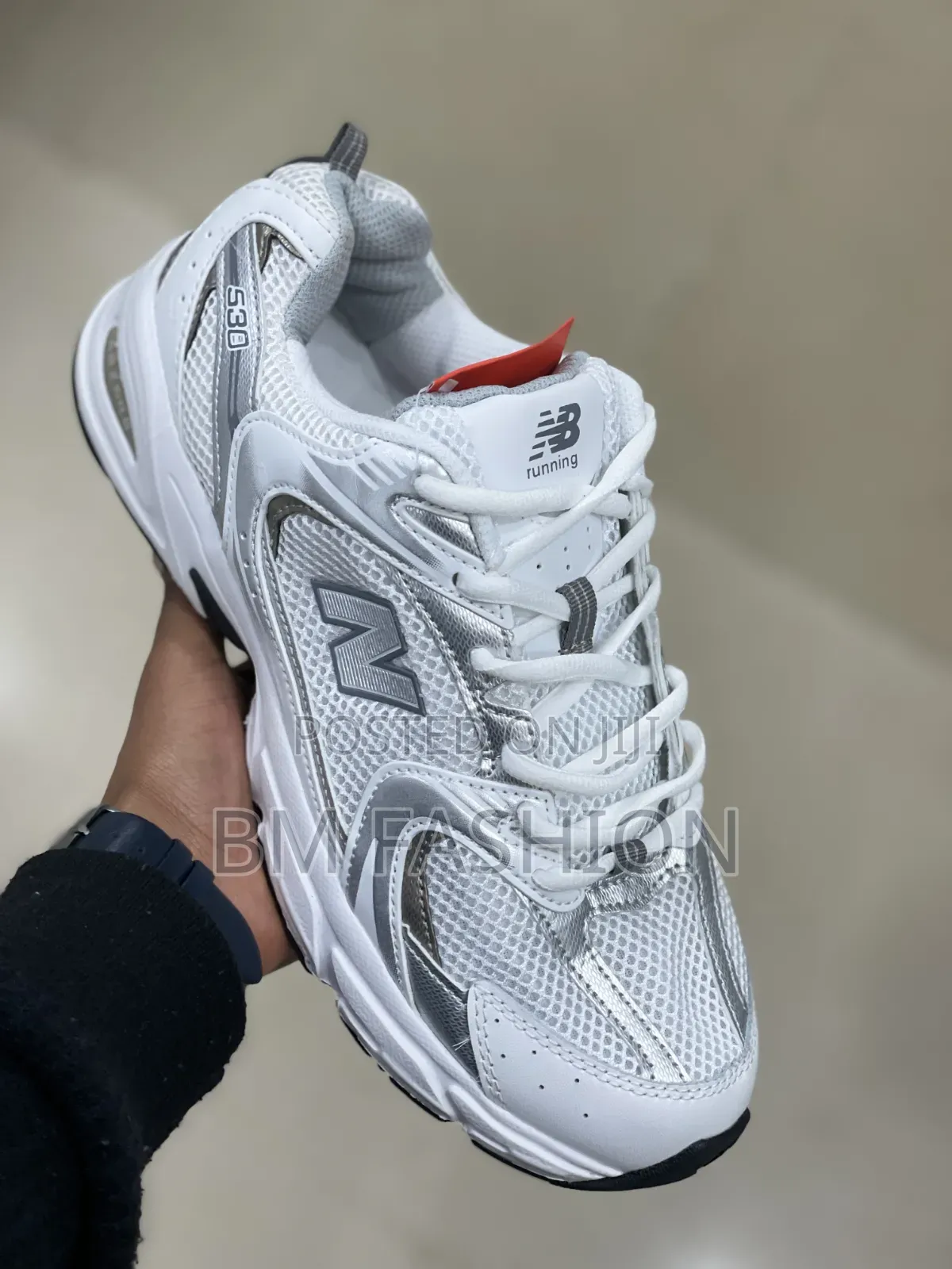 White and Silver New Balance 530 Sneaker With a Breathable Mesh Upper