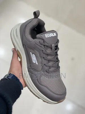 Grey Skechers Outdoor Goodyear Sneaker With a Beige and Brown Sole