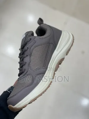Grey Skechers Outdoor Goodyear Sneaker With a Beige and Brown Sole