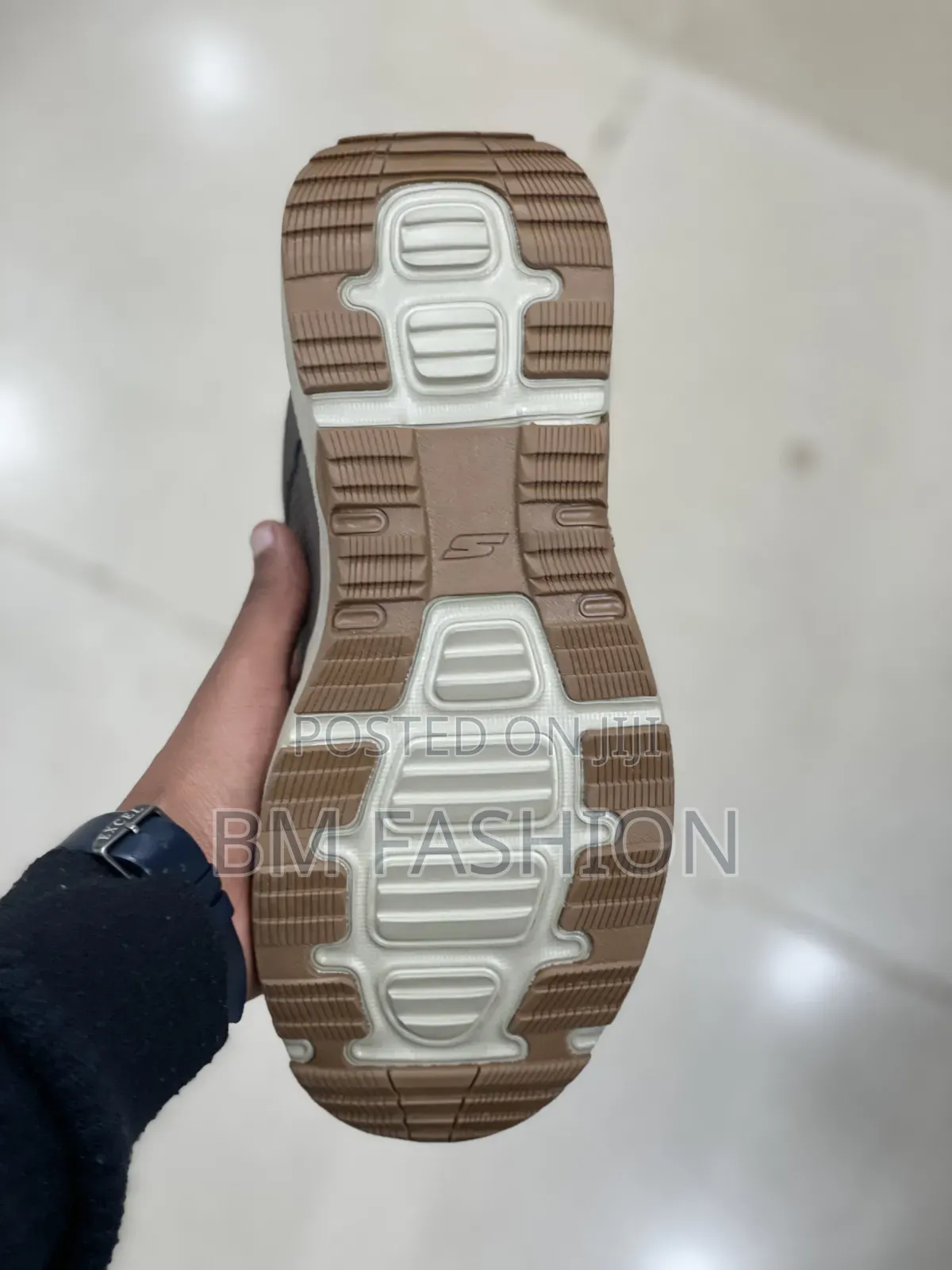 Grey Skechers Outdoor Goodyear Sneaker With a Beige and Brown Sole
