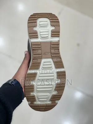 Grey Skechers Outdoor Goodyear Sneaker With a Beige and Brown Sole