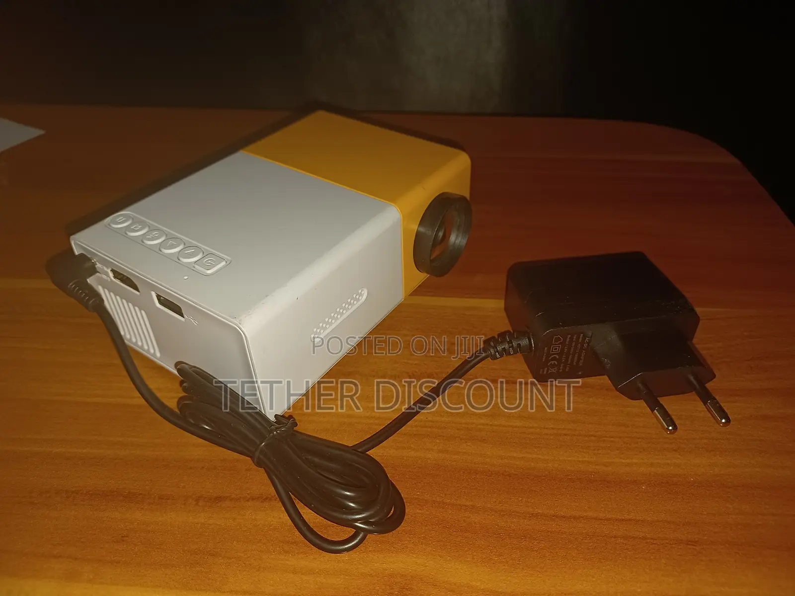 YG-300 Portable Mini LED Projector With Its Power