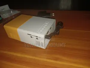 YG-300 Portable Mini LED Projector With Its Power