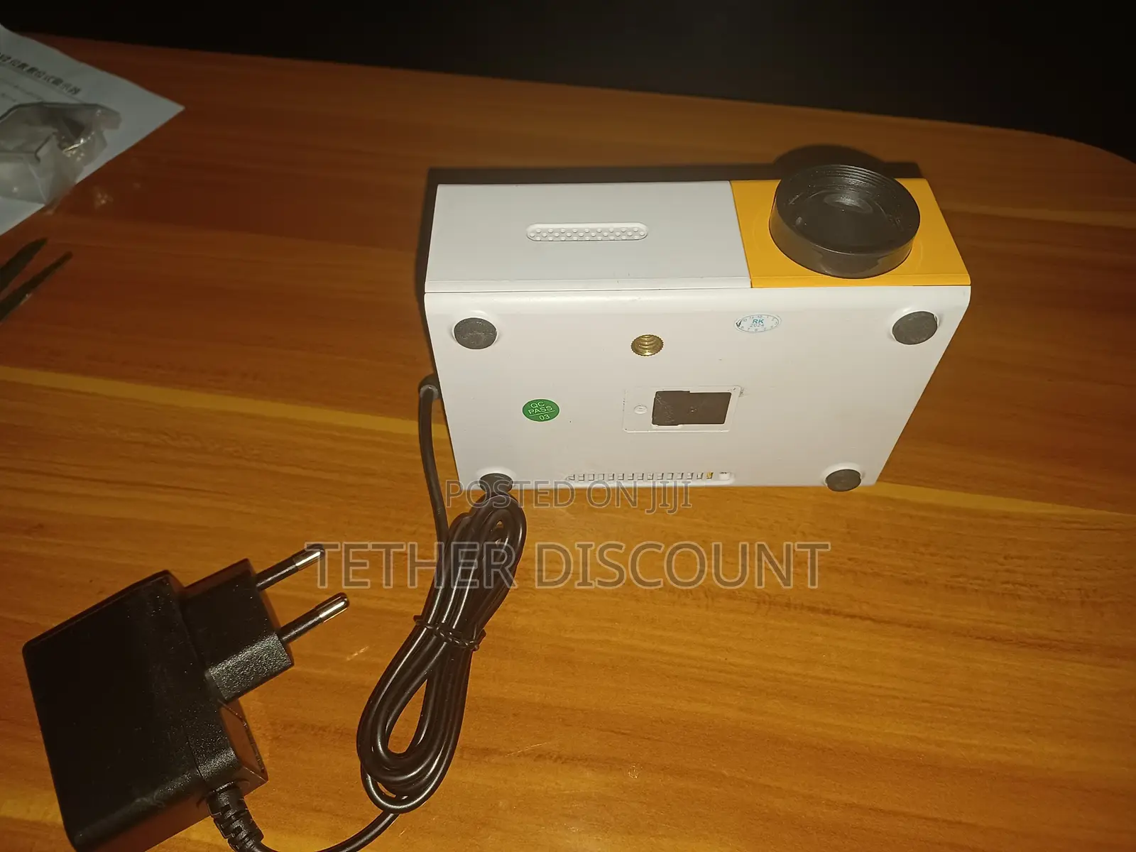 YG-300 Portable Mini LED Projector With Its Power
