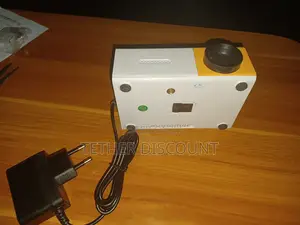 YG-300 Portable Mini LED Projector With Its Power