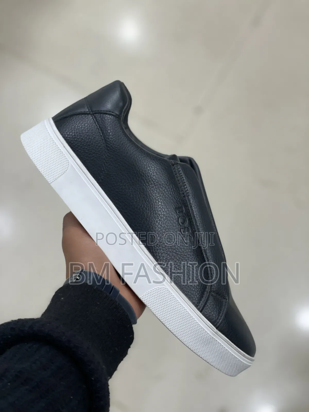 Boss Sleek Black Slip-on Sneaker Showcases a Textured Leather Upper