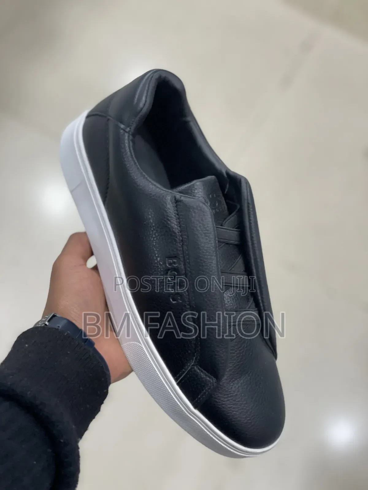 Boss Sleek Black Slip-on Sneaker Showcases a Textured Leather Upper