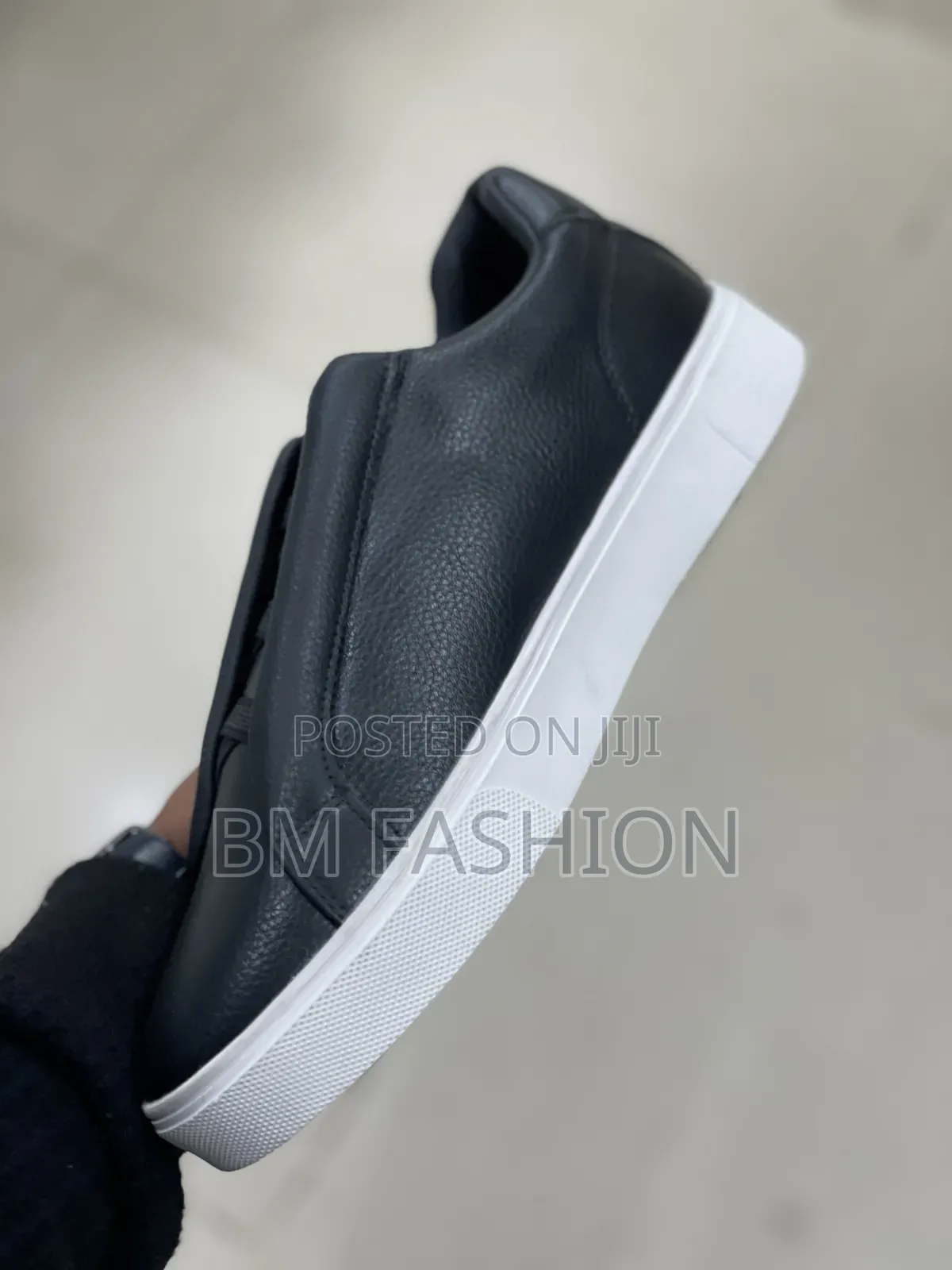 Boss Sleek Black Slip-on Sneaker Showcases a Textured Leather Upper