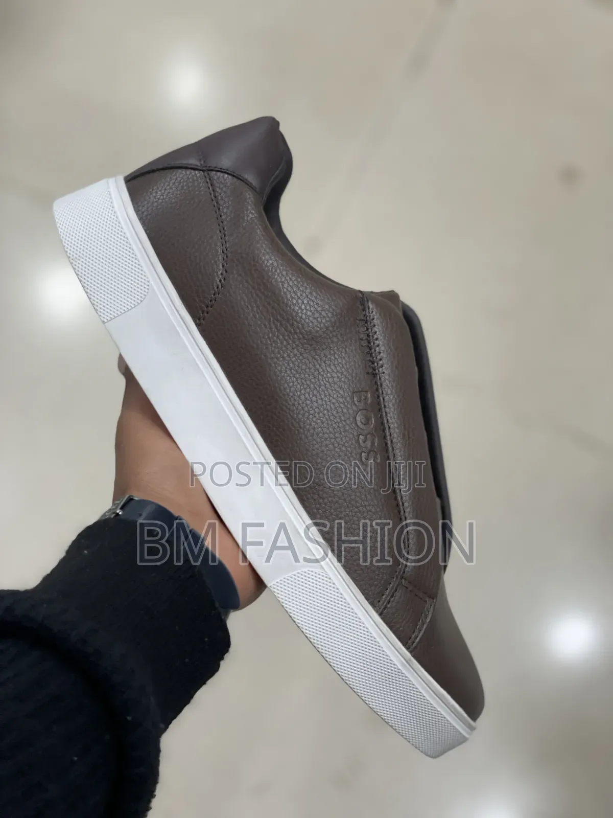 Sleek Brown Boss Casual Sneaker Featuring a Textured Leather Upper