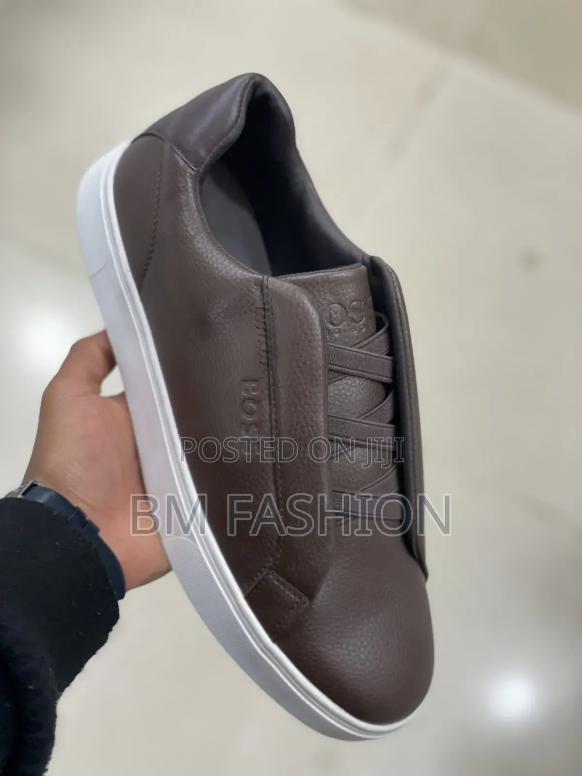 Sleek Brown Boss Casual Sneaker Featuring a Textured Leather Upper