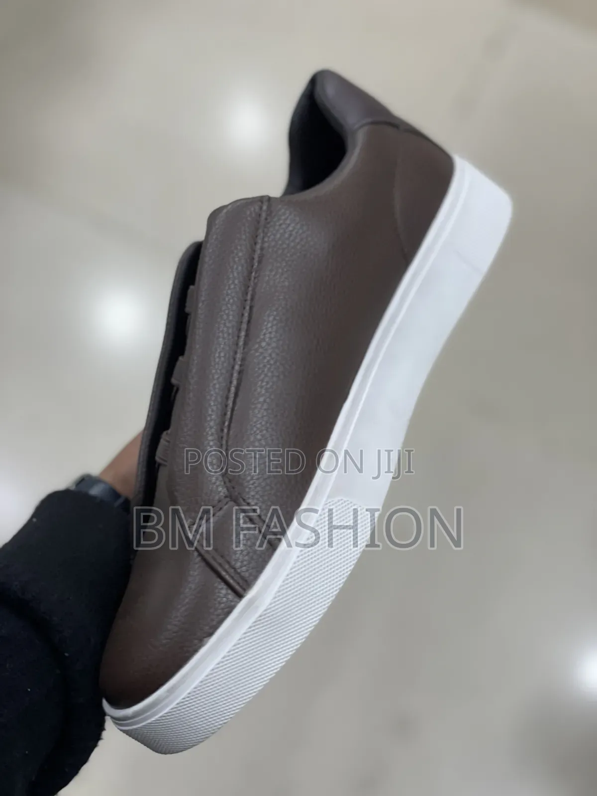 Sleek Brown Boss Casual Sneaker Featuring a Textured Leather Upper