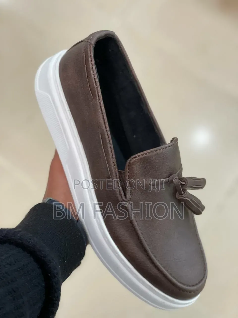 Slip-on Loafer Features a Distinctive Decorative Tassel Accent