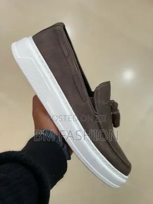 Slip-on Loafer Features a Distinctive Decorative Tassel Accent