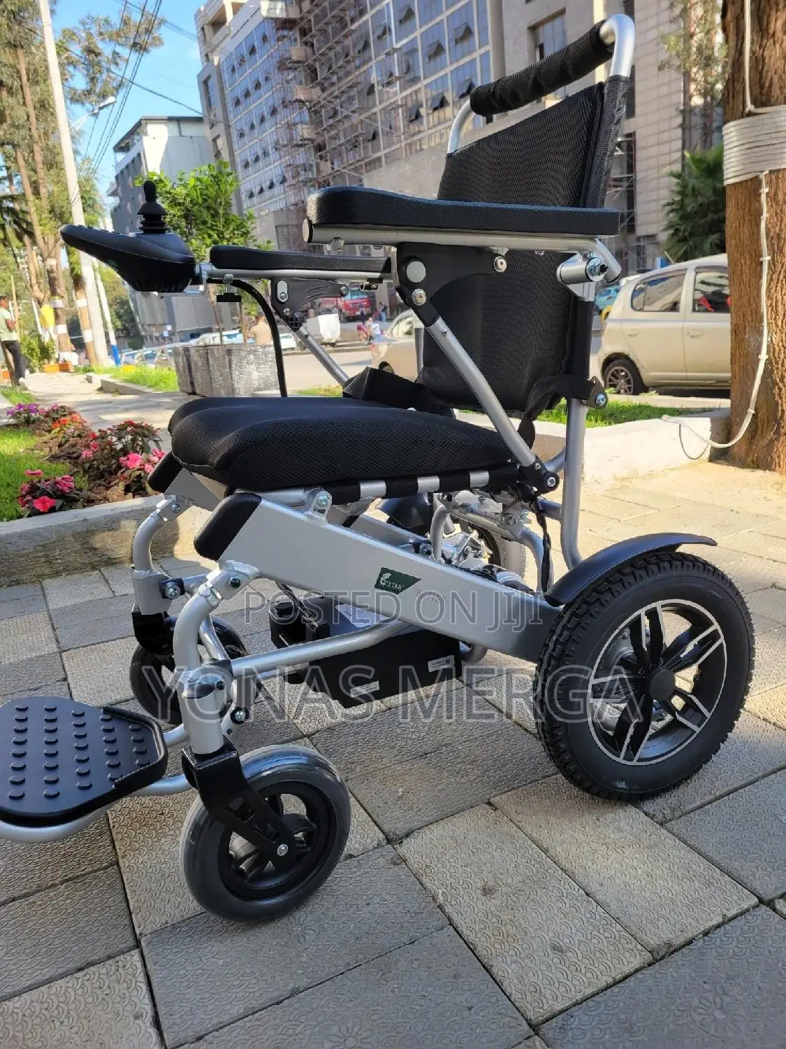 Electrical Wheelchair=joystick Controller, a Black Mesh Seat Cushion